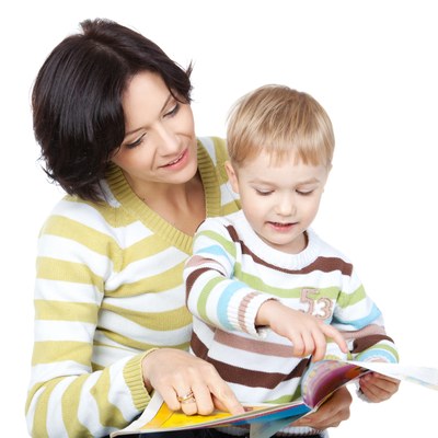 Teacher and boy reading